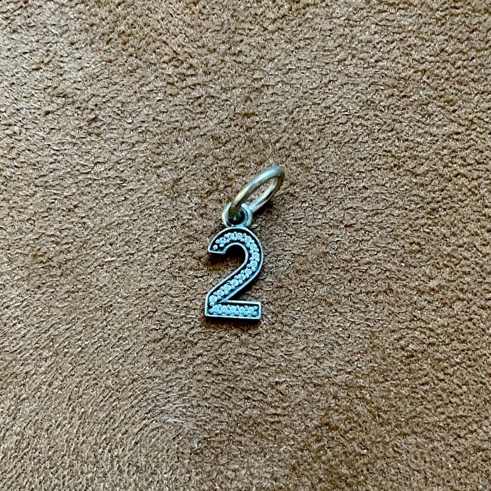 Pandora charm  sterling silver and crystals number 2 shape.